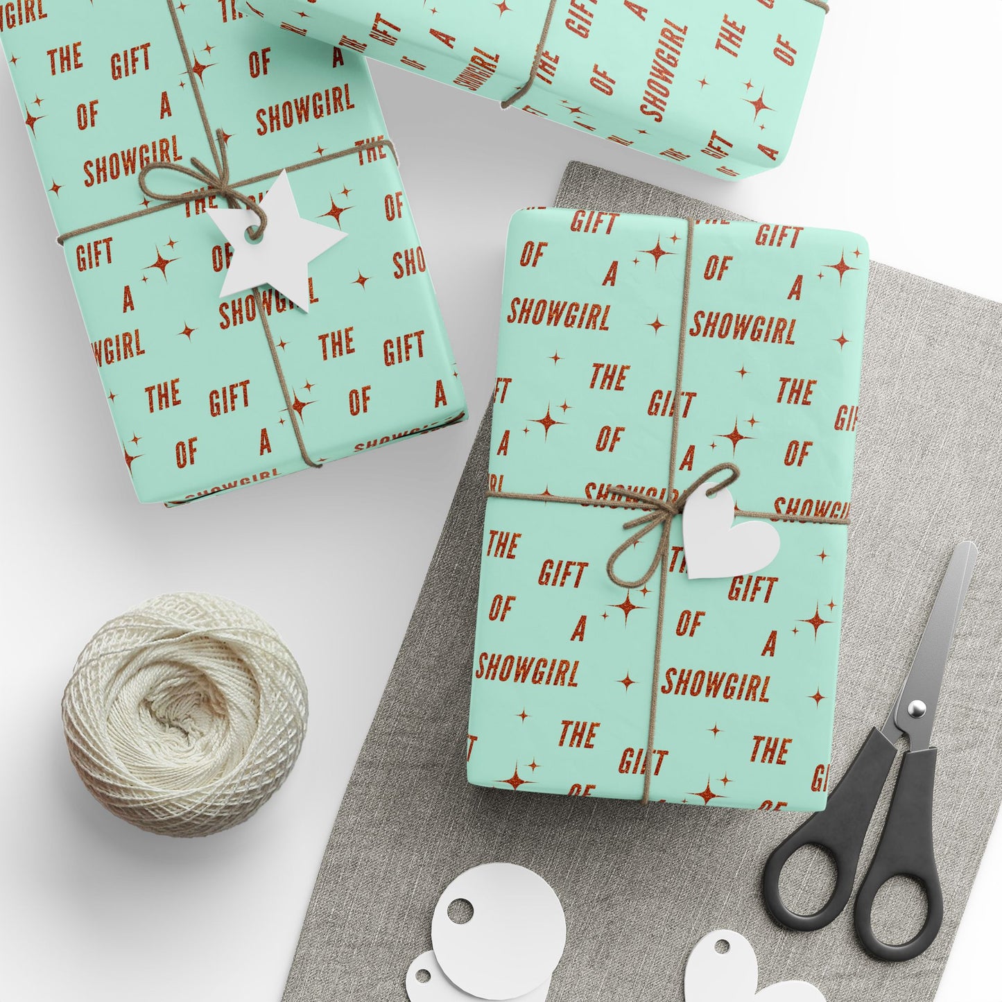 The Gift of a Showgirl matte wrapping paper roll, present mockup, by Merry May