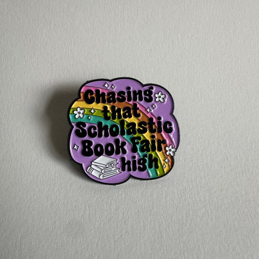 Chasing That Scholastic Book Fair High Enamel Pin, 1.3” x 1.3” - Merry May