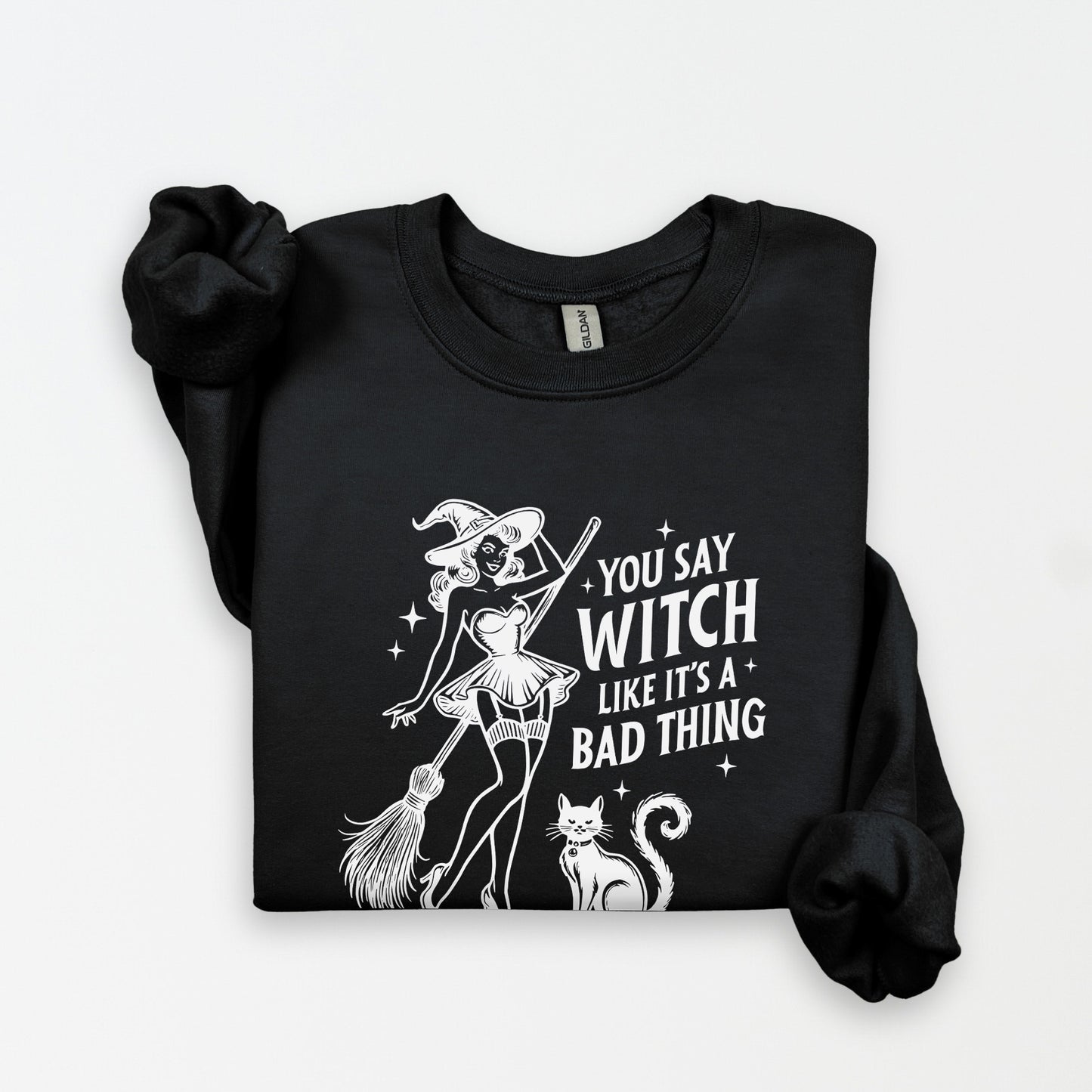 Black sweatshirt with a graphic of a witch and text on a white background