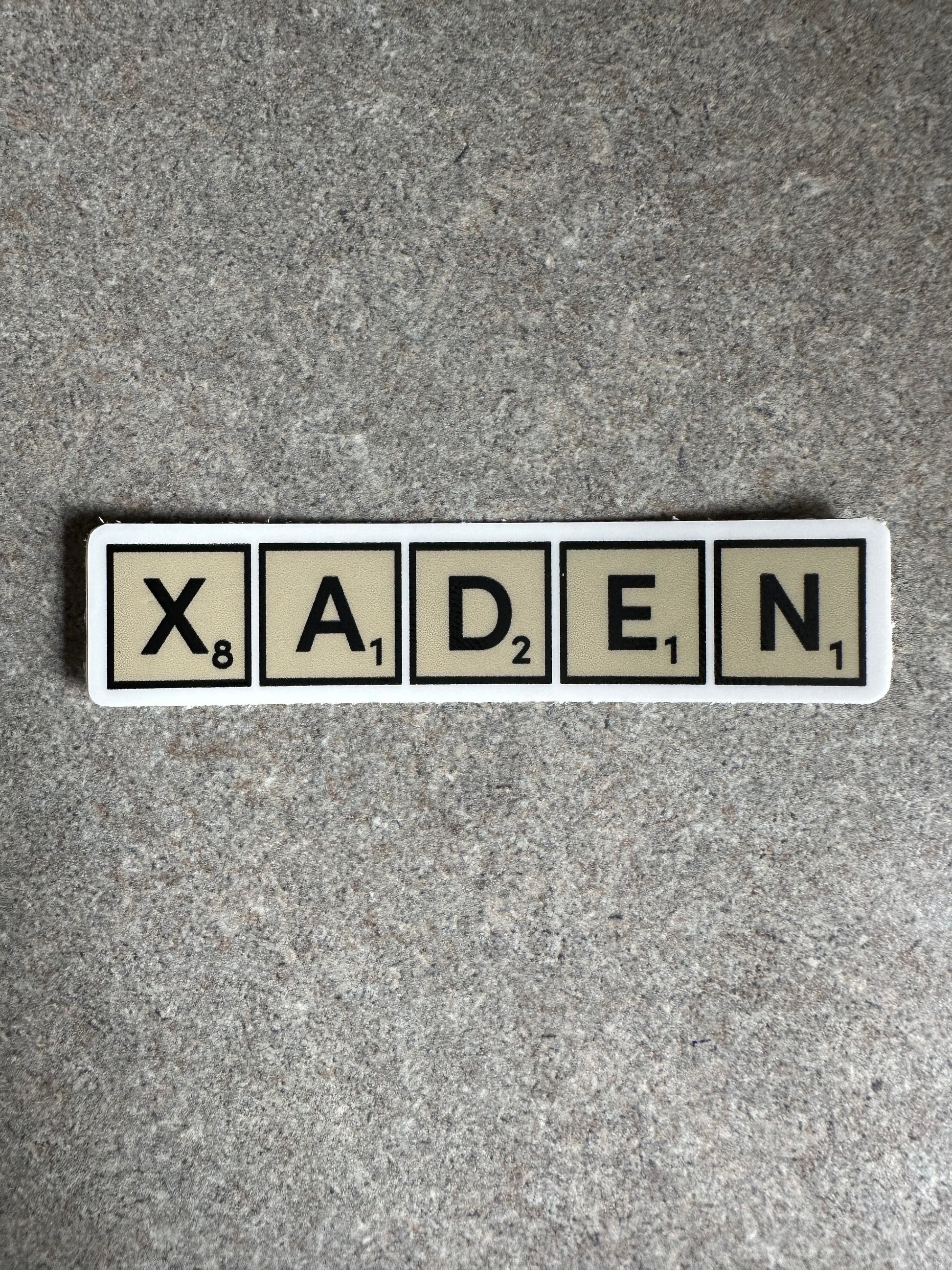 Xaden Game Tiles Vinyl Sticker, 3.0” x 0.68” - Merry May